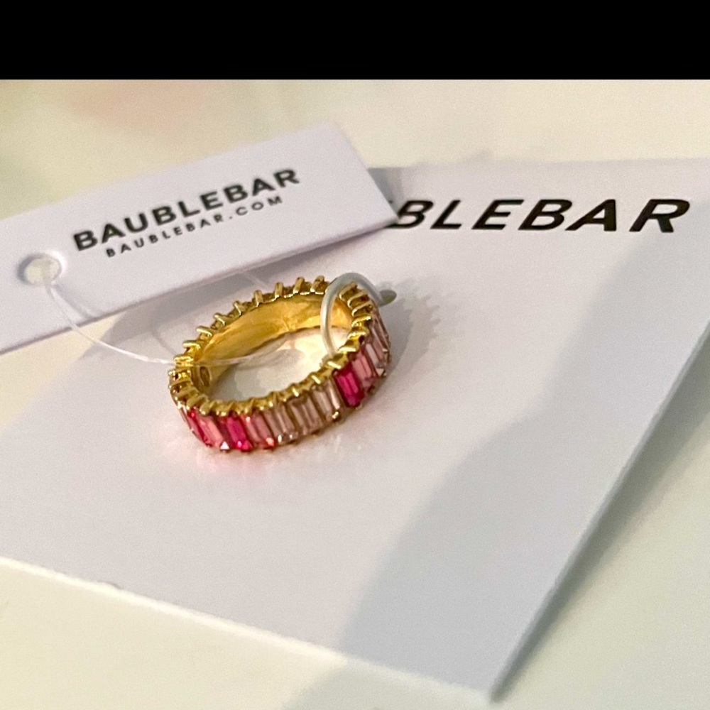 New w tag Baublebar gold ring with 3 tones of pink stones all around Size 5